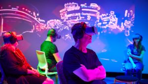 Group of people wearing virtual reality headsets