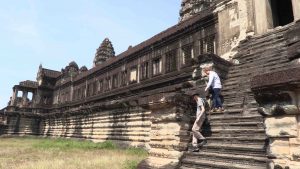 People descending steps at Angkor Wat temple