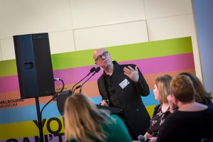 Jon McCormack giving a presentation in front of an audience
