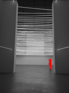 Black and white space with red figure