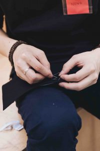 Close up person sewing