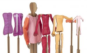 A series of cardboard mannequins showing the speculative design for the AR