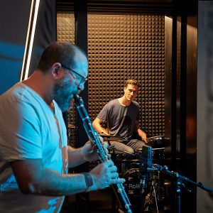 Two musicians performing to train a neural network