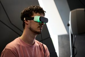 Image of a man using the dream machine goggles